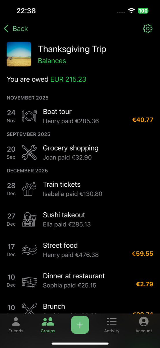 CostSplit group expense list in dark mode showing categorized expenses